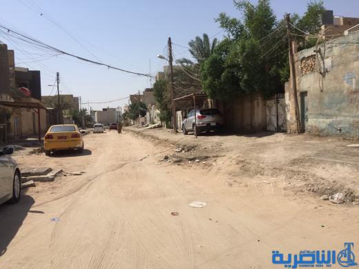 بالصور : اعمال الاكساء تتواصل في شارع بغداد وعدد من احياء الناصرية