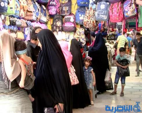 رغم غلاء الاسعار ، اسواق العيد في الناصرية منتعشة والكليجة على موائد المهنئين - تقرير مصور -