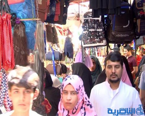 رغم غلاء الاسعار ، اسواق العيد في الناصرية منتعشة والكليجة على موائد المهنئين - تقرير مصور -