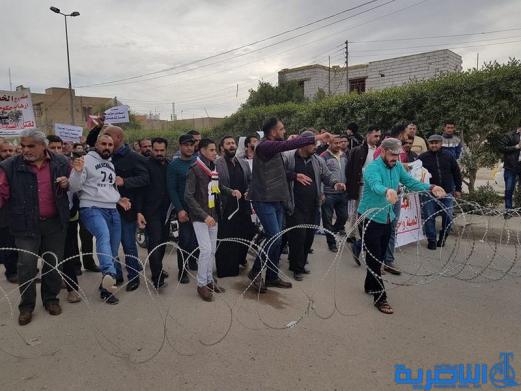 بالصور:العشرات يتظاهرون ضد الخصخصة في ذي قار