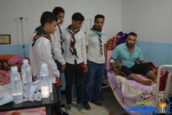 كشافة التضامن توزع الورود على جرحى الحشد الشعبي بمناسبة عيد الغدير 