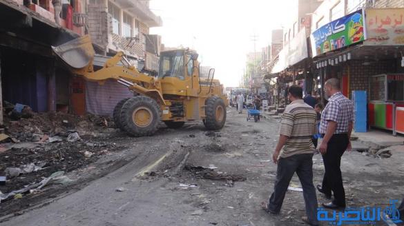 بالصور : بلدية الشطرة ترفع 1250 طنا من انقاض حريق سوق الخان