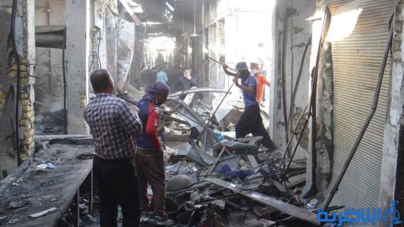 بالصور : بلدية الشطرة ترفع 1250 طنا من انقاض حريق سوق الخان