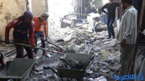 بالصور : بلدية الشطرة ترفع 1250 طنا من انقاض حريق سوق الخان