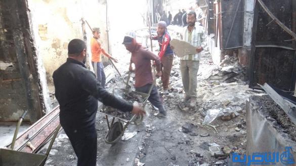 بالصور : بلدية الشطرة ترفع 1250 طنا من انقاض حريق سوق الخان