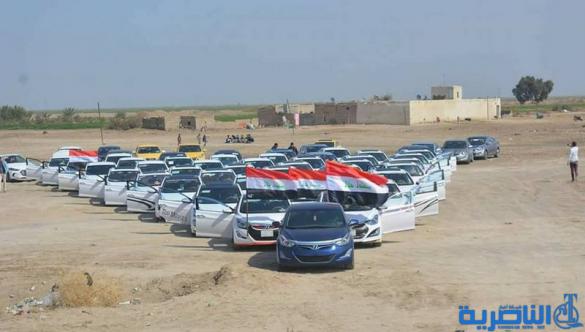 بالصور :شباب على الفيس بوك يعبدون طريقا في الناصرية على نفقتهم الخاصة - تقرير مصور-