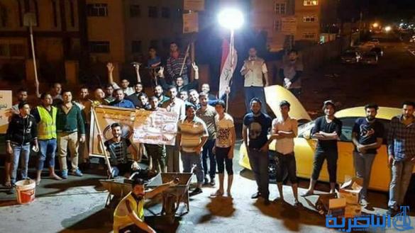 بالصور :شباب على الفيس بوك يعبدون طريقا في الناصرية على نفقتهم الخاصة - تقرير مصور-