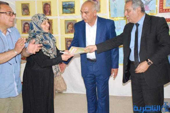 معرضا فنيا في مدرسة سعيد بن جبير الابتدائية في الناصرية