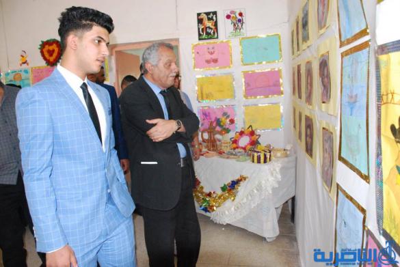 معرضا فنيا في مدرسة سعيد بن جبير الابتدائية في الناصرية