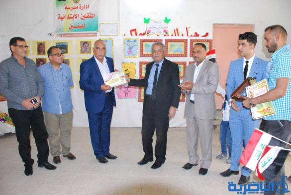 معرضا فنيا في مدرسة سعيد بن جبير الابتدائية في الناصرية