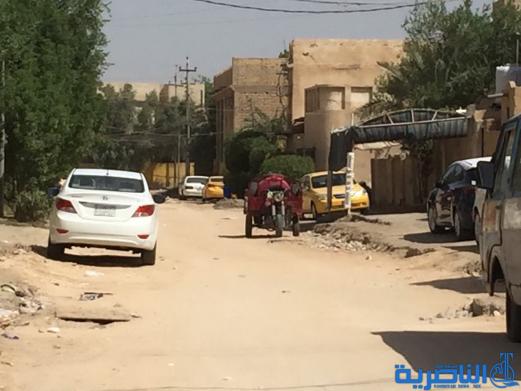 بالصور : اعمال الاكساء تتواصل في شارع بغداد وعدد من احياء الناصرية