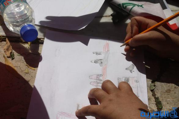  مدرسة العدنانية تقيم معرضا للرسم الحر في ساحة الحبوبي - تقرير مصور -