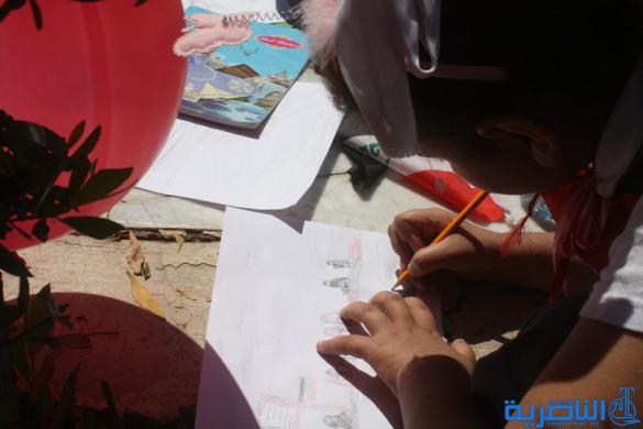  مدرسة العدنانية تقيم معرضا للرسم الحر في ساحة الحبوبي - تقرير مصور -