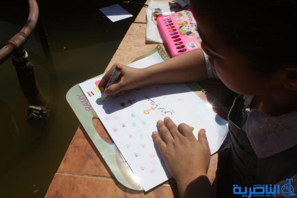  مدرسة العدنانية تقيم معرضا للرسم الحر في ساحة الحبوبي - تقرير مصور -