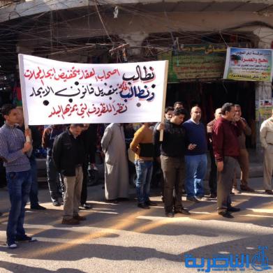  اصحاب المتاجر في الحبوبي يتظاهرون للمطالبة بقانون يكبح ارتفاع الايجارات - تقرير مصور -