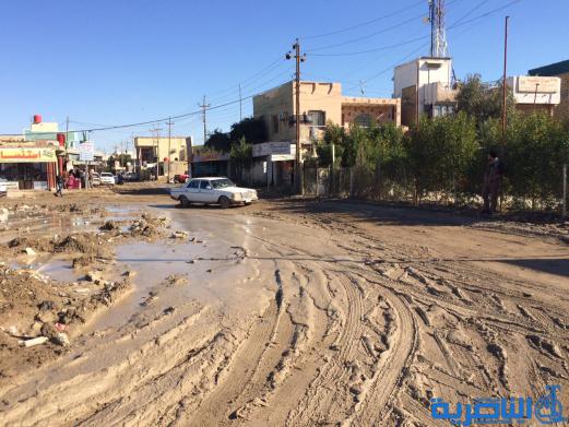 متظاهرون في الناصرية يقطعون طريقا رئيسيا للمطالبة بالخدمات - تقرير مصور -