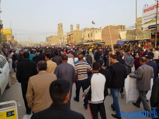 بالصور:المئات يتظاهرون في وسط الناصرية ضد مشروع خصخصة الكهرباء 