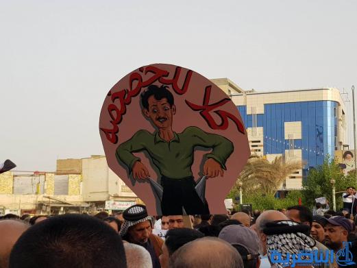 بالصور:المئات يتظاهرون في وسط الناصرية ضد مشروع خصخصة الكهرباء 