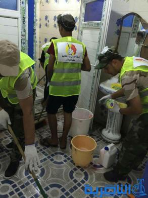  بالصور : متطوعو الحشد الشعبي ينظمون حملة لتنظيف مستشفى الحسين في الناصرية