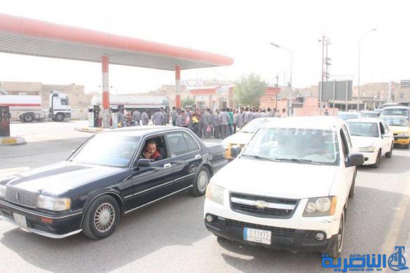 الناصرية :عمال في محطة وقود يتظاهرون بعد ان سرحتهم الحكومة لتعيين اخرين من طرفها - تقرير مصور -