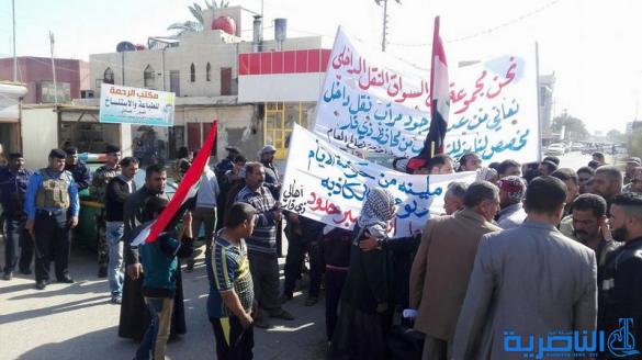 سائقوا الاجرة يتظاهرون للمطالبة بانشاء مراب للنقل وسط الناصرية - تقرير مصور -