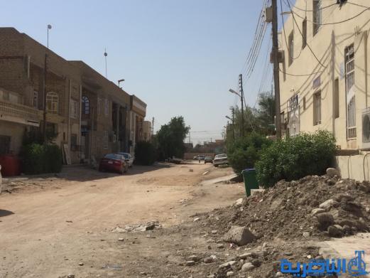 بالصور : اعمال الاكساء تتواصل في شارع بغداد وعدد من احياء الناصرية