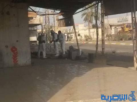  بالصور .. فرقة مقنعة تعالج آثار صواريخ الكلور وسط القيارة