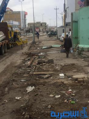  بالصور : رفع "الصبات الكونكريتية" الحيطة بمصرف الرافدين في صوب الشامية