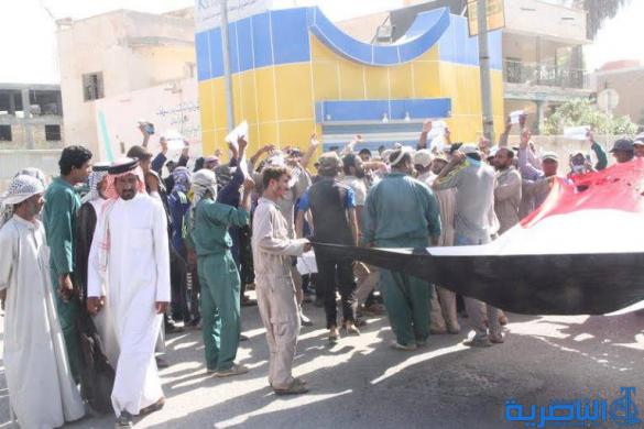  العشرات من الاجراء اليوميين يتظاهرون في الناصرية للمطالبة بزيادة الاجور - تقرير مصور -
