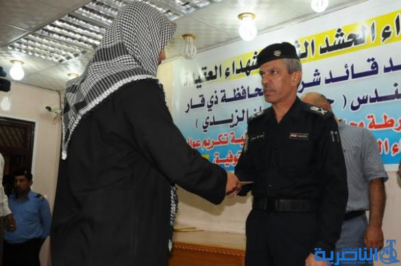 شرطة ذي قار تكرم 57 عائلة من عوائل شهداء الحشد الشعبي - تقرير مصور -
