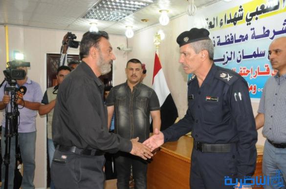 شرطة ذي قار تكرم 57 عائلة من عوائل شهداء الحشد الشعبي - تقرير مصور -