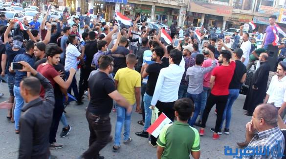 بالصور:العشرات في الناصرية يتظاهرون تضامنا مع اهالي البصرة