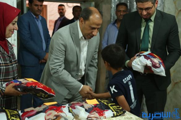 محافظ ذي قار يوزع هدايا وكسوة العيد على الايتام - تقرير مصور - 