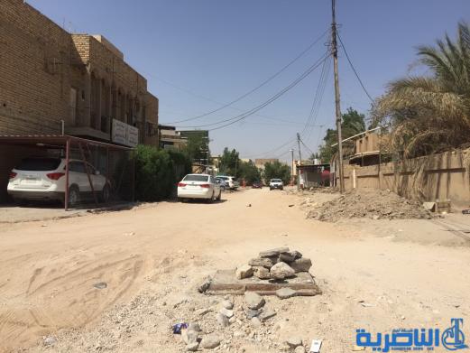 بالصور : اعمال الاكساء تتواصل في شارع بغداد وعدد من احياء الناصرية
