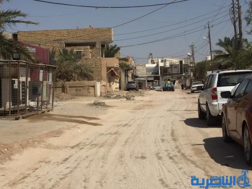 بالصور : اعمال الاكساء تتواصل في شارع بغداد وعدد من احياء الناصرية