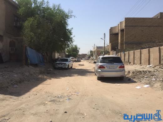 بالصور : اعمال الاكساء تتواصل في شارع بغداد وعدد من احياء الناصرية