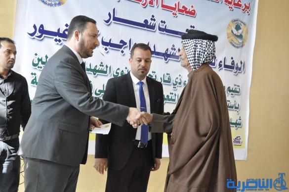 ‎توزيع منح مالية لذوي الشهداء و المصابين في ذي قار