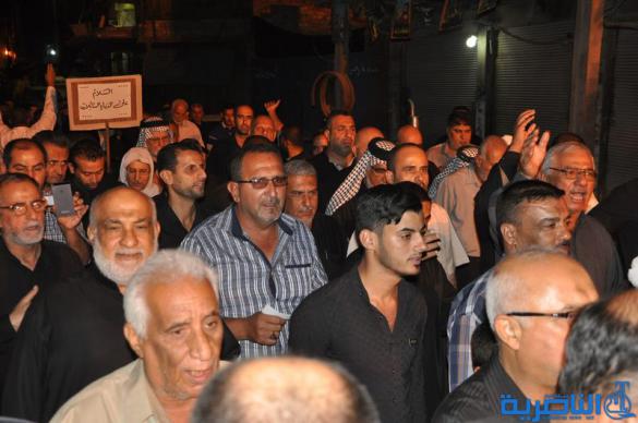 بالصور:المواكب الحسينية في ليلة التاسع من المحرم في الناصرية