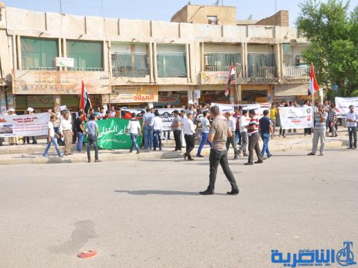 انطلاق تظاهرة في الناصرية للمطالبة بالغاء الرواتب التقاعدية للبرلمان - تقرير مصور -