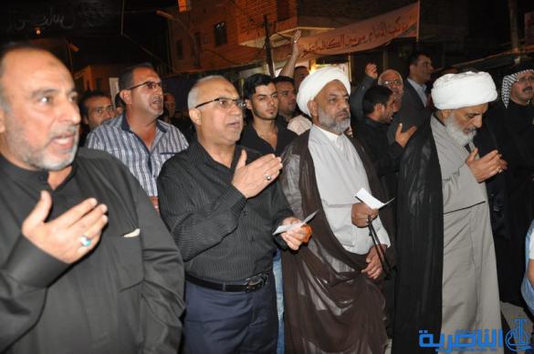 بالصور:المواكب الحسينية في ليلة التاسع من المحرم في الناصرية