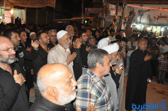 بالصور:المواكب الحسينية في ليلة التاسع من المحرم في الناصرية