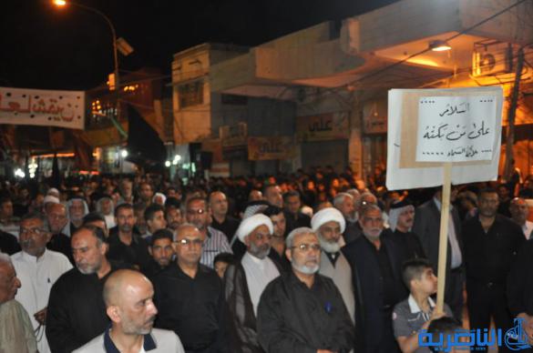 بالصور:المواكب الحسينية في ليلة التاسع من المحرم في الناصرية