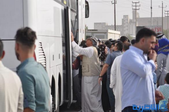 عودة 21 قافلة من حجاج ذي قار بعد اتمام مناسك الحج  - تقرير مصور -