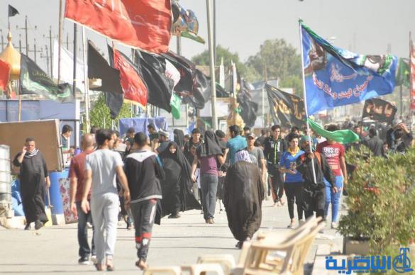بالصور : طريق العشق الحسيني في ذي قار ينبض بالمشّائين الى كربلاء