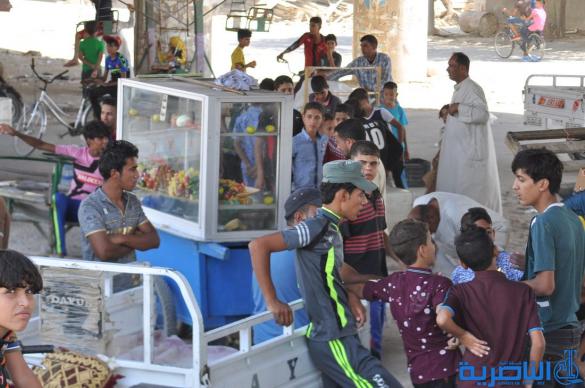 اطفال ذوي الدخل المحدود في الناصرية يقضون ايام عيد الاضحى بساحات خاوية - تقرير مصور-