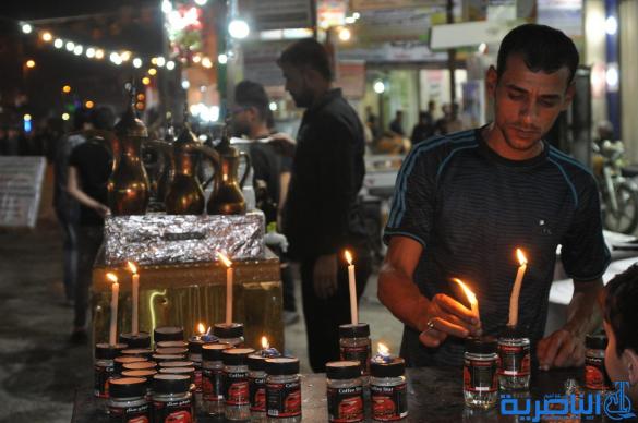 بالصور:احياء ذكرى ليلة التاسع من المحرم في مدينة الناصرية