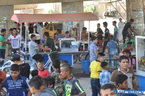 اطفال ذوي الدخل المحدود في الناصرية يقضون ايام عيد الاضحى بساحات خاوية - تقرير مصور-