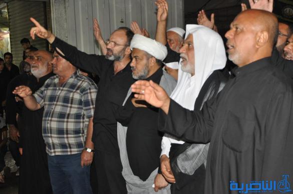 بالصور:المواكب الحسينية في ليلة التاسع من المحرم في الناصرية