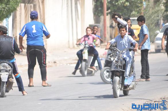اطفال ذوي الدخل المحدود في الناصرية يقضون ايام عيد الاضحى بساحات خاوية - تقرير مصور-