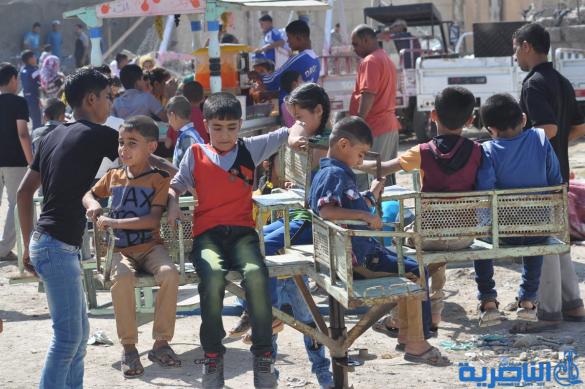 اطفال ذوي الدخل المحدود في الناصرية يقضون ايام عيد الاضحى بساحات خاوية - تقرير مصور-